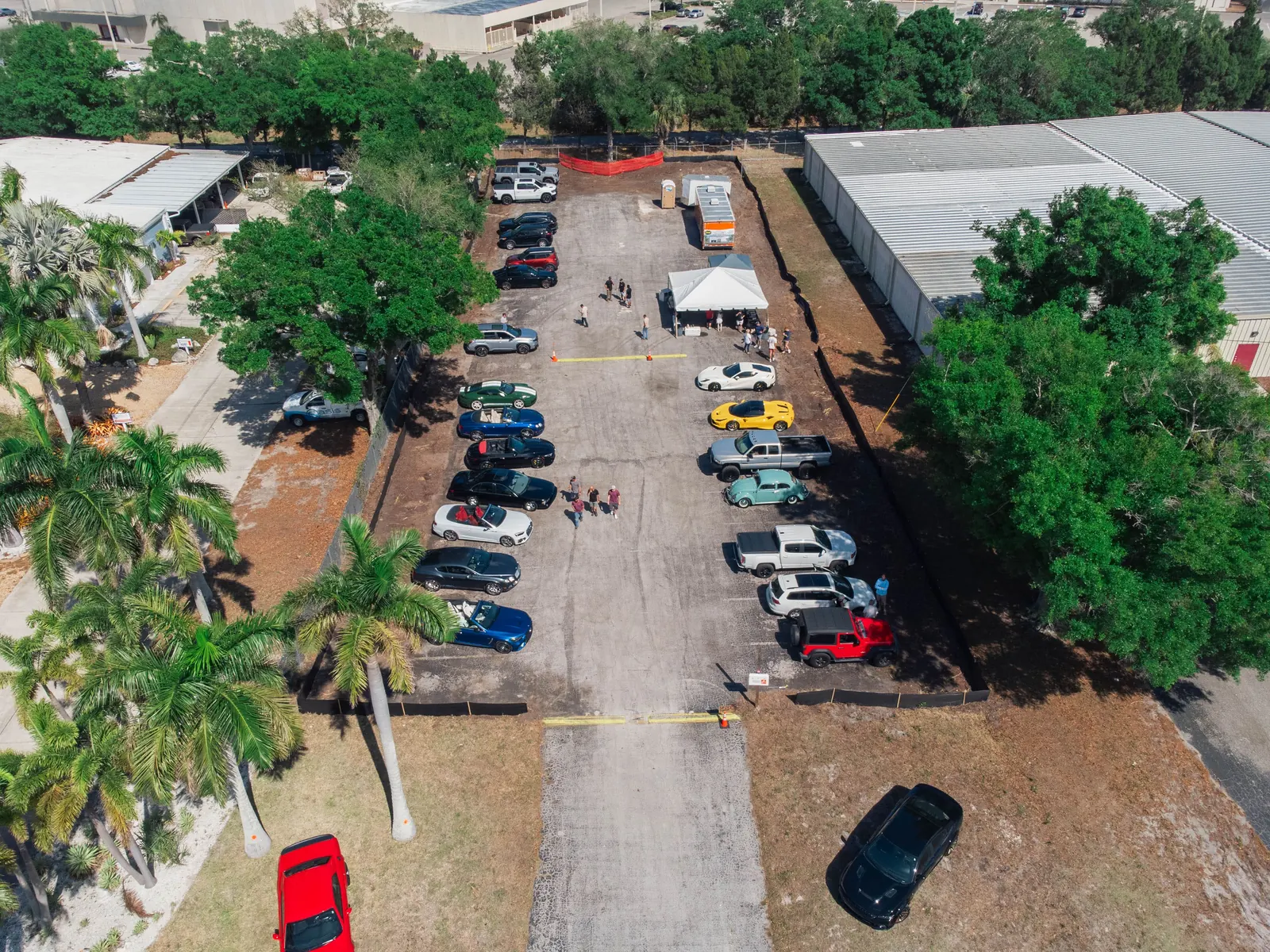 Aerial view of cars and people gathered at an Anvil Auto Vault community meet